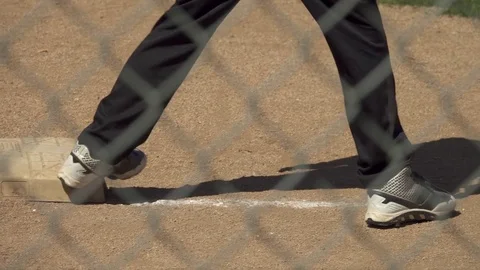 A boy is on base while playing in a little league baseball game. Stock Footage