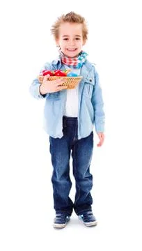 Boy with basket full of Easter eggs Stock Photos