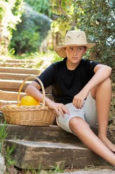 Boy with a basket of melons 스톡 사진