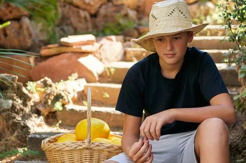 Boy with a basket of melons 스톡 사진