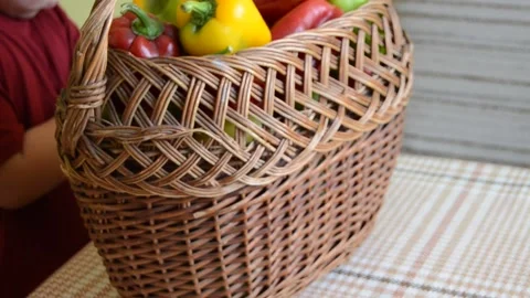 Boy with a basket of peppers Stock Footage 141373259