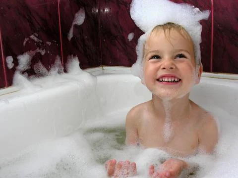 Boy in bath Stock Photos