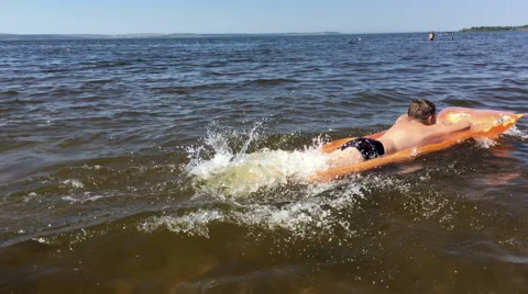 Boy bathes in the river Stock Footage 66355598