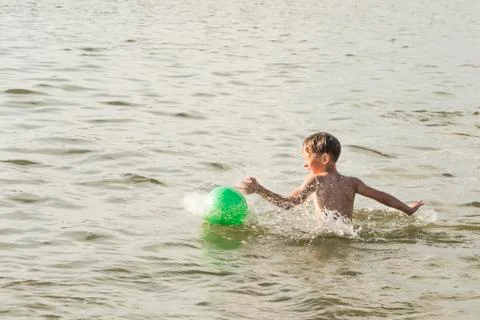 Boy bathes in the river Stock Photos