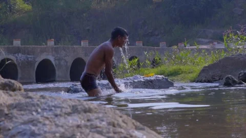 A Boy bathing in the river Stock Footage 204786095