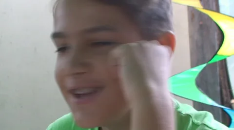 The boy in the bathroom fun laughs and says something interesting Vídeos de archivo 67347856