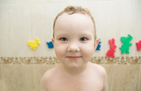 Boy in bathroom Stock Photos