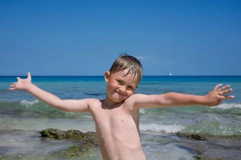 The boy on the beach. Stock Photos