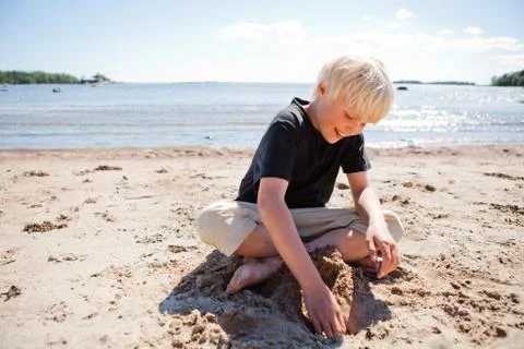 Boy on the beach Stock Photos