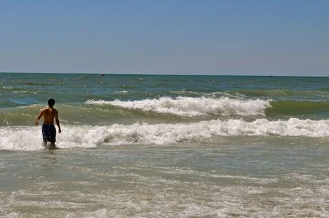 Boy on the beach Fotos Stock
