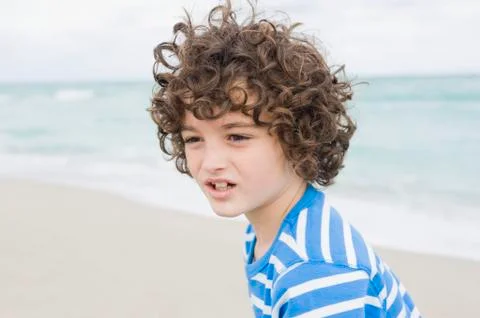Boy on the beach Stock Photos