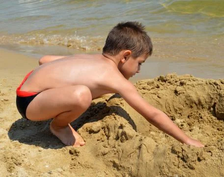 Boy on the beach Stock Photos
