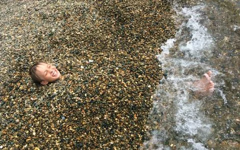 Boy on the beach Stock Photos