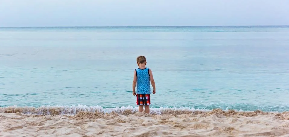 Boy on the beach Fotos Stock