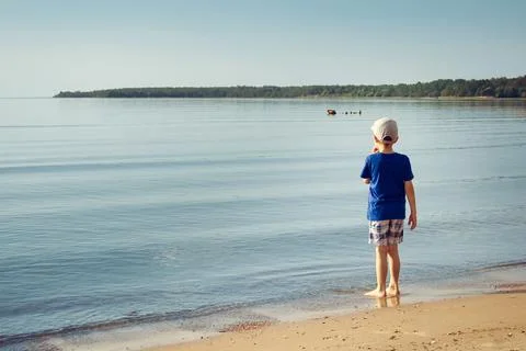 A boy on the beach Stock Photos