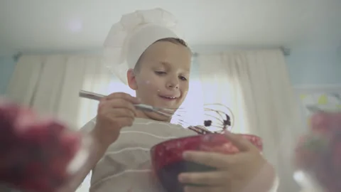 Boy with Beater Whisk Mixing Jam for Cooking Cake Stock Footage 159149209