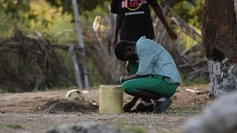 Boy beats the rhythm with a bin Stock Footage 69254872