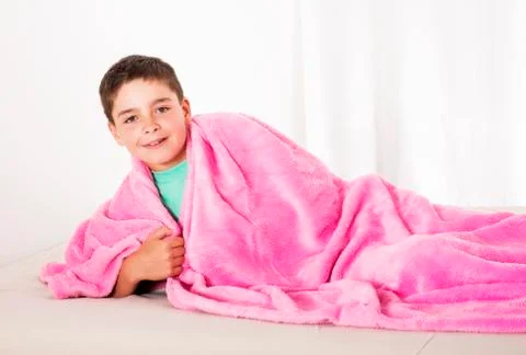 Boy in bed Stock Photos