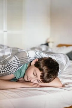 Boy in a bed Stock Photos