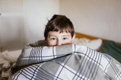 Boy in a bed Stock Photos