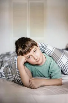 Boy in a bed Stock Photos