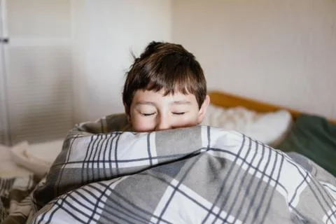 Boy in a bed Stock Photos