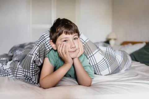 Boy in a bed Stock Photos