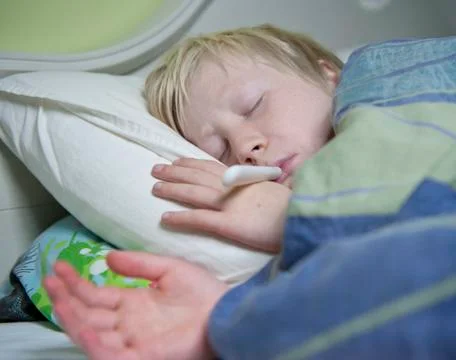 Boy in bed sick Stock Photos