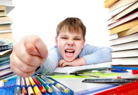 Boy behind a table with books 스톡 사진