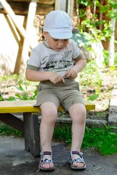 Boy on the bench Stock Photos