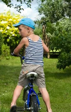 The boy with a bicycle Stock Photos