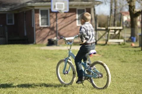 Boy on a Bicycle Stock Photos