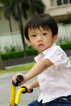 Boy on a bicycle Stock Photos