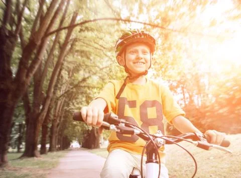 Boy on bicycle Stock Photos