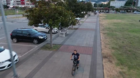 Boy on a bicycle. Summer 2023 Stock Footage 255429377