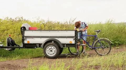 Boy With Bicycle,  Young man with bicycle in a wheat field Stock Footage 45741179