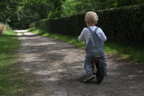 Boy bicycling Fotos de archivo
