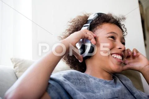 Boy With Big Earphones Enjoying Music