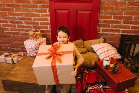 Boy with big gift Stock Photos