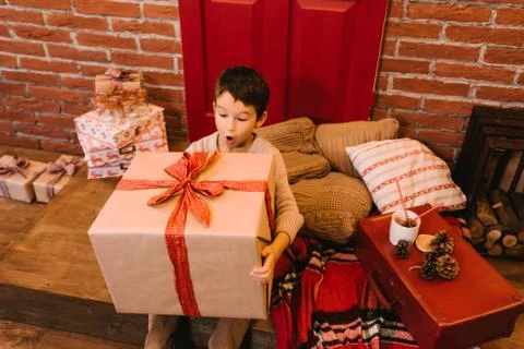 Boy with big gift Stock Photos