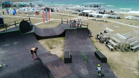 Boy on bike performs tricks in skate park Video stock 103034753