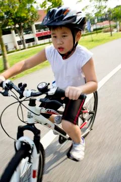 Boy on bike Stock Photos