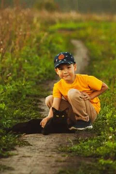 A boy with a black cat Stock Photos