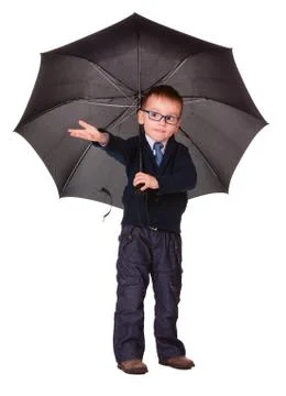 Boy in black clothes standing under umbrella Stock Photos