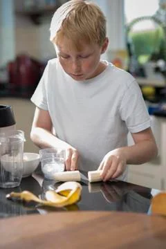 Boy blending a smoothie Stock Photos
