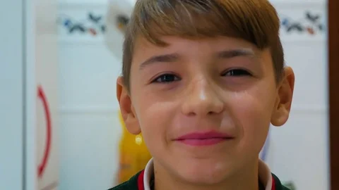 The boy blinks his eyes Stock Footage 83619266