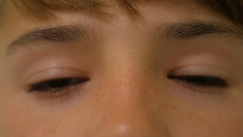 The boy blinks his eyes Stock-Footage 83629021