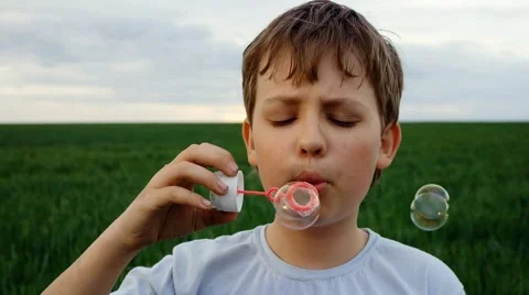 Boy blow bubbles outdoors 스톡 동영상 46842471
