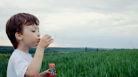 Boy blow bubbles outdoors Stock-Footage 46842741