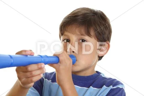 Boy blowing blue horn Stock Photos